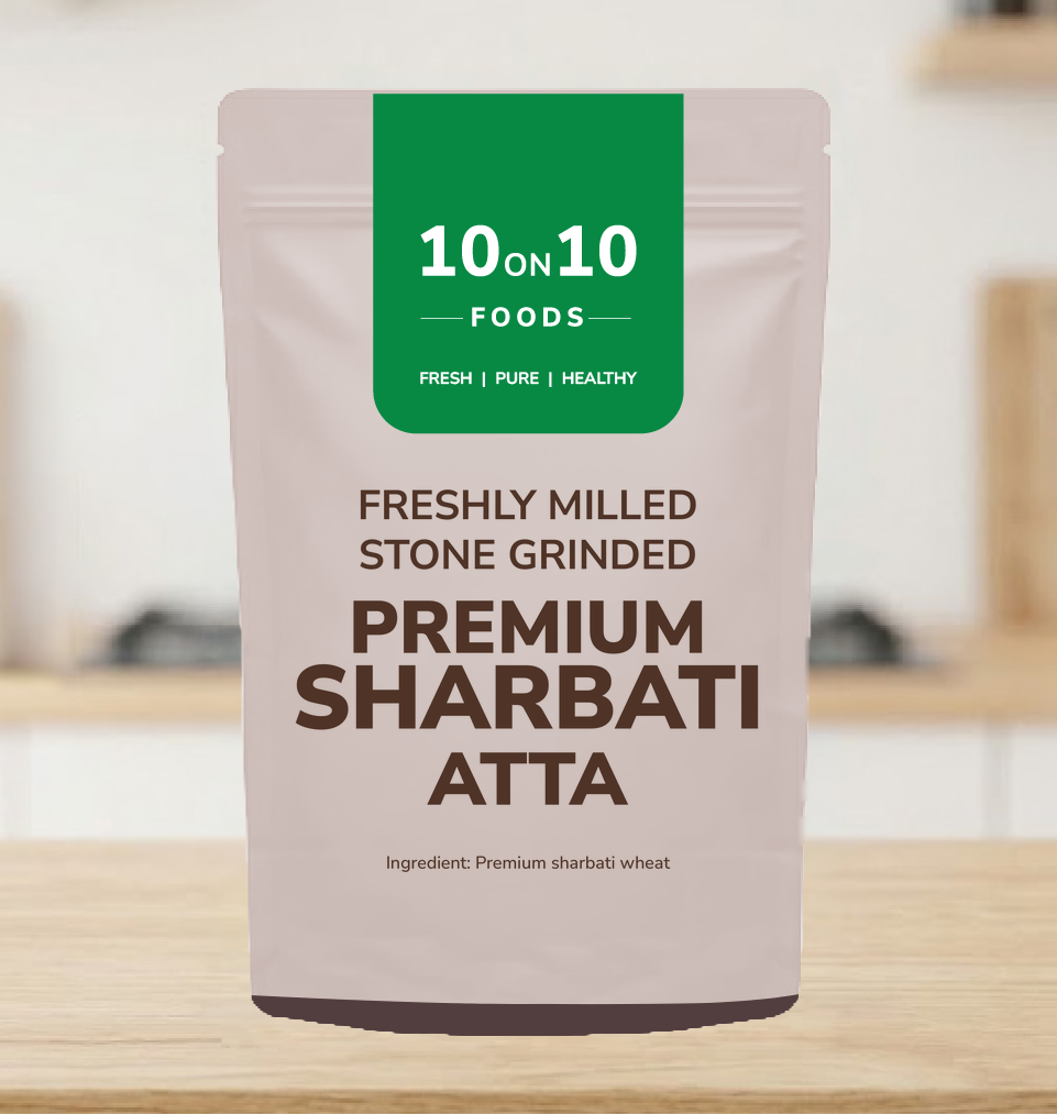 10on10 Foods Premium Sharbati Atta 500g pack on a kitchen counter